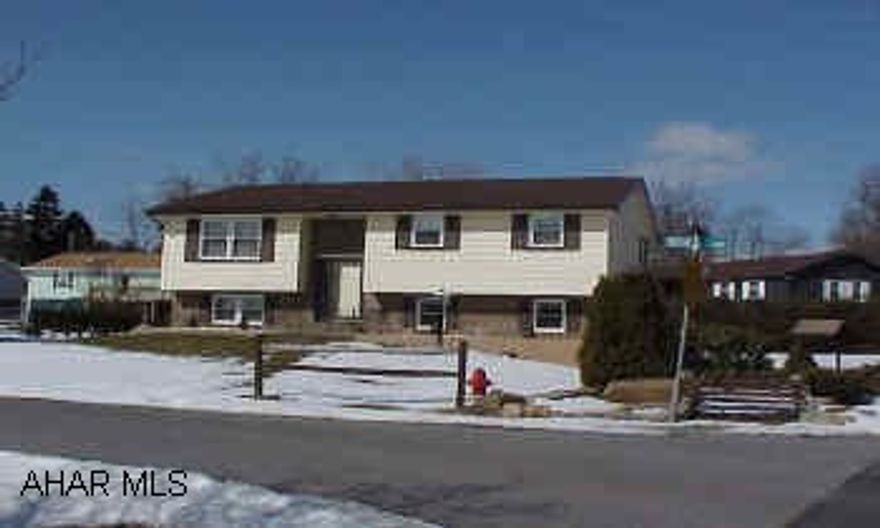 Totally re-modeled new kitchen and  bath.  Newer furnace with central air.  Newer vinyl siding, windows, and roof.  Rear deck and concrete patio.  Newer carpets.