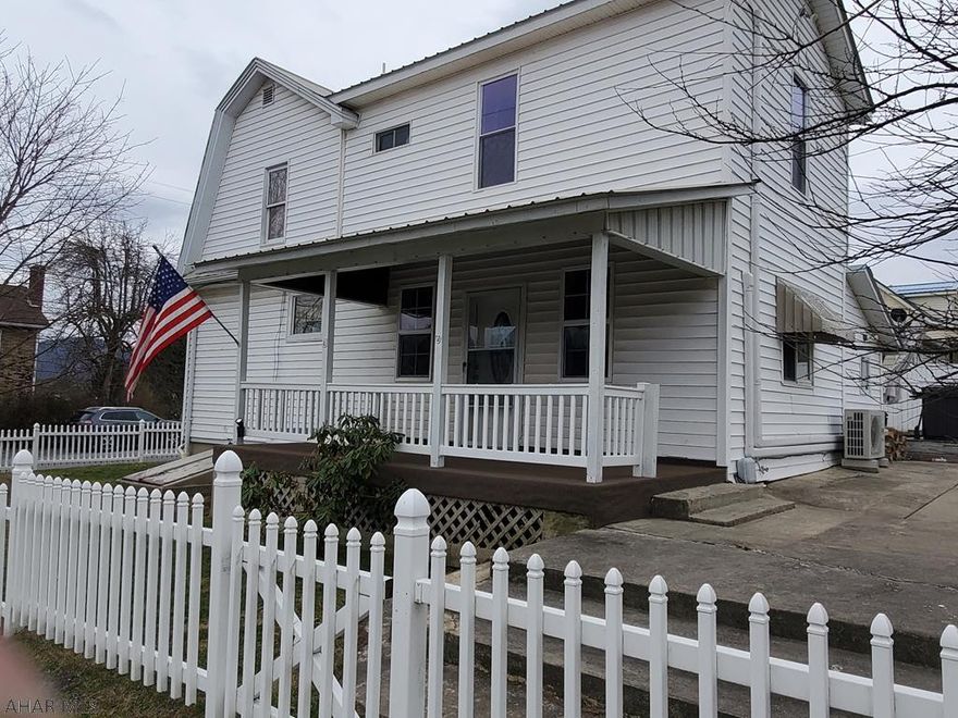 Everything you need and more in this beautiful home waiting for you to move right in. Come home after a long day and relax in the hot tub or sit around the fire pit within the completely fenced in yard with a beautiful white picket fence. This house boasts country appeal with its gorgeous kitchen with cherry cabinets, wood molding, pantry, closet and all appliances. Spacious living room with vinyl plank flooring and bathroom off the living room with an extra room that could be your office. Added convenience with your washer and dryer on main floor. Two bedrooms with a master bedroom with bath upstairs. A one car garage and a car port are just a few more added features to this beautiful updated home. Call today to take your tour.