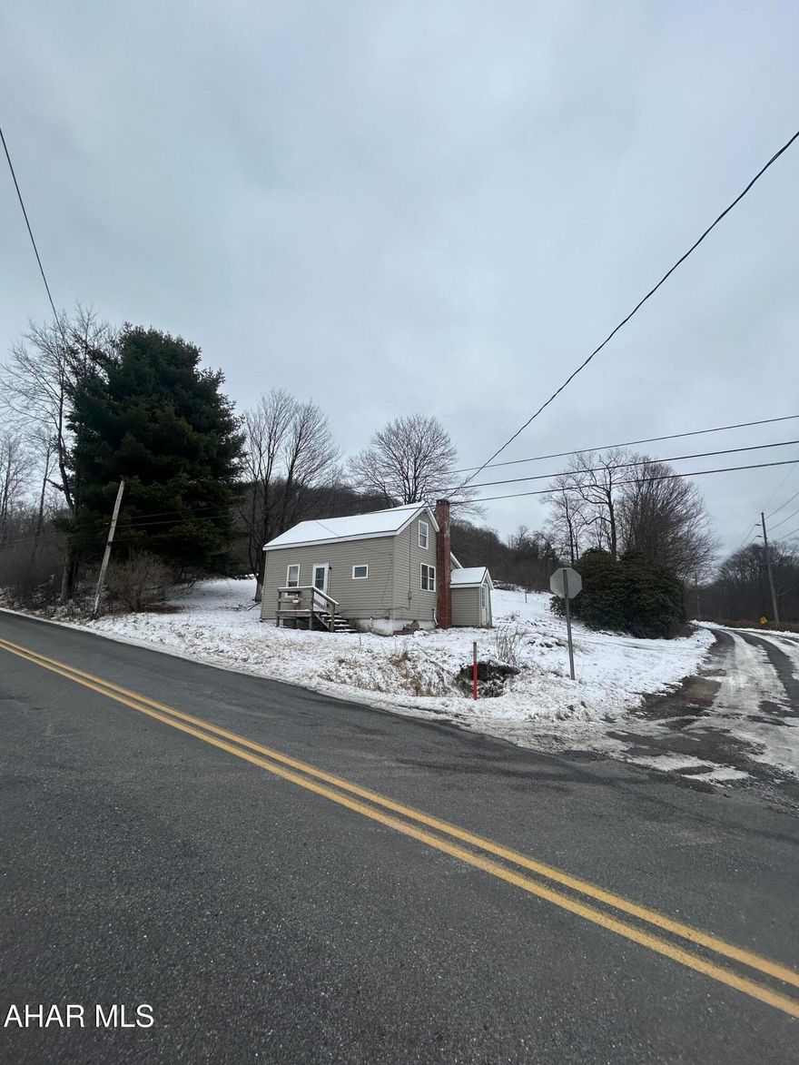 Two bedroom home nestled in on approximately 2.466 acres between 3 separate parcels.  Second bedroom is captive. The home is connected to public sewer and has a well.  Public water is available at the curb and would need connected by the buyer according to the seller.  The home is in need of repair and currently no utilities are on.  The home had an oil furnace at one time.  Oil tank still present as well as a wood burner in the basement for heat.  Home being sold as is. No repairs to be made by sellers.

Buyers to confirm taxes, square footage and lot size.  Buyers/agents to sign a hold harmless prior to showing.