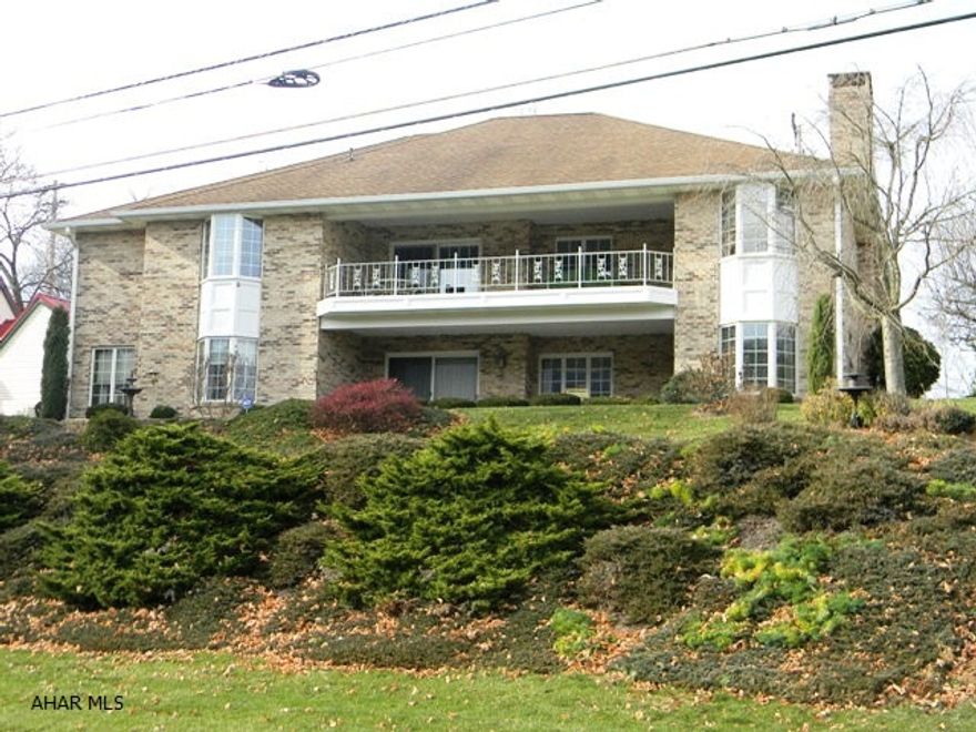 Quality brick ranch home with spectacular views. Situated above the Bedford Elks Country Club, the main level of this home offers a LR w/brick hearth fireplace, kitchen with cherry cabinets, dining area w/walk-out doors, formal DR, a den, 2-full baths, 3 beds, one of which is a large master suite w/walk-in closet and ceramic tile bath. Full finished basement featuring a large family room w/wet bar, a half bath, office and additional bedroom. Basement is walkout to a large covered patio. Zoned heating w/heat pumps and central air, multiple built-ins throughout, 2-car finished and insulated garage, full attic storage. Very low maintenance property, walking distance to downtown Bedford, Bedford Springs Resort and schools. Super location!