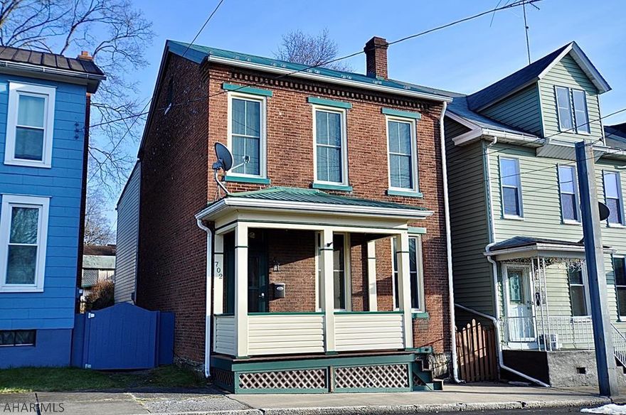 This sweet brick 2 1/2 story home has lots of charm, low taxes, and is clean and read to move in! Modern bathroom and kitchen, new metal roof, lots of replacement windows, modern 100 amp electrical panel, natural gas hot air heat and hot water heater, great fenced in rear yard, 1 car detached garage with attached carport ... this is a wonderful, inexpensive home that is move in read!