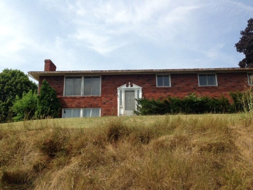 Solid brick home in beautiful neighborhood. 4 to 5 bedrooms, 2 1/2 baths, 2 fireplace, large garage. Gorgeous view. Lots of square footage at a great price.