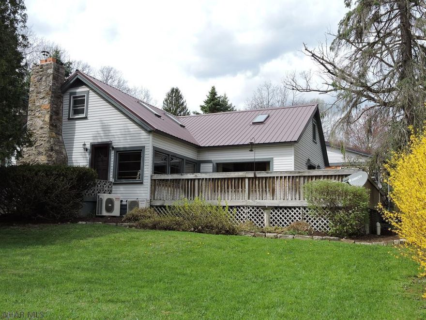 charming cottage style home with large addition 1994.  24x60 heated garage with 24x24 workshop 2 9x8 overhead doors.  3 season pavilion with wood burning fireplace, cable & electric.  3 storage trailers include cut wood Beautiful lot with 3 apple trees adjoins Altoona City Authority water shed. 3 separate heating systems Oil hot water, woodburning insert in living room & mini-splits for heat and ac.