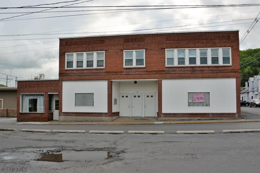 Great investment property located downtown consisting of two apartments, office space, two large storage areas, and off street parking. Priced to sell with many updates recently done. Call now!!