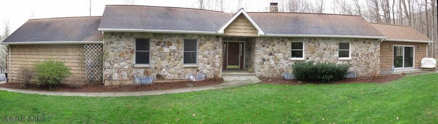 In a small dev., this property is surprisingly private. Easy care, low maintenance, this quality built, vinyl shaker style shingle & stone house was designed to fit into its wooded setting. Walk into this house and breath in the serenity. Open, warm, & inviting, the space conveys a sense of peace that welcomes you home. The spa-like addition w/ hot tub helps melt away aches, pains, & the cares of the day. Watch birds & wildlife while sipping your morning coffee. Inside, every window gives you a view of the ever changing faces of nature. The bsmt could be finished as family/ entertainment space or the ultimate man-cave.There's enough room for all 3! Do you have 7 minutes? It's a 7 min. drive to downtown Bedford. If you're a hunter-hiker-nature lover-it's a 7 min walk to state game lands