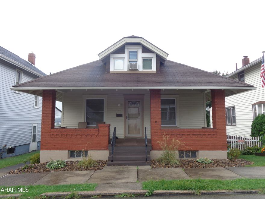 Move right into this attractive 3 Bedroom home with hardwood floors and original woodwork.  2 Bedrooms and Bathroom on the main floor and a spacious Bedroom or Bonus Room on the second floor. All new windows, large covered front porch.  The Kitchen has 3 Lazy Susan's in addition to plenty of cabinets and counterspace & all appliances included.