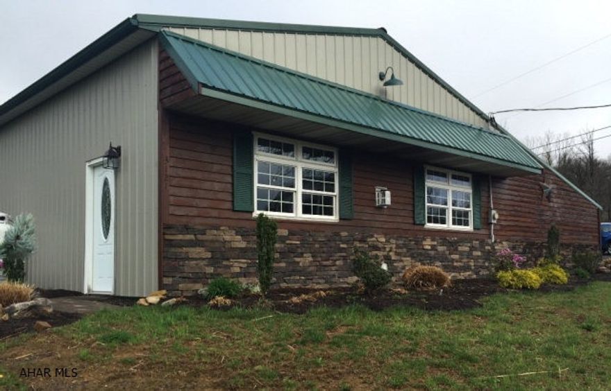 Quality built and open concept makes this a rare find home perfectly located near thousands of acres of State Game Lands. The location could not be better as it is less than a 20-minute drive of Omni Bedford Springs, Historic Bedford and Cumberland Maryland. Everything in this home is new... floors, designer bathrooms & kitchen, central air conditioning, roof, windows, doors, laundry room and so much more... The open concept design gives the home as spacious and inviting feel while the master suite offer privacy with its own bathroom and large closet. One floor living at its best. The addition of a two-car garage and a quiet peaceful location makes this a must see home that will not last long...