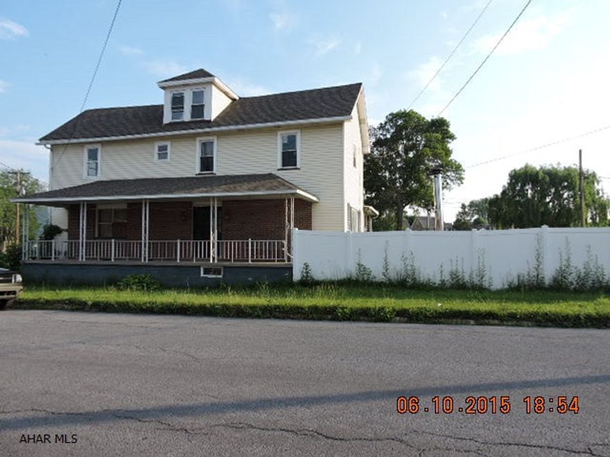 This property is now under auction terms.  All offers should be submitted through www.auction.com.  this property is subject to a 5% buyer's premium pursuant to the Auction Terms & Conditions (minimums may apply).  Please contact listing agent for details. Large home with lots of potential.  Fenced corner lot.  Heat is an outdoor wood furnace with gas back up. Converts to hot air heat in house.