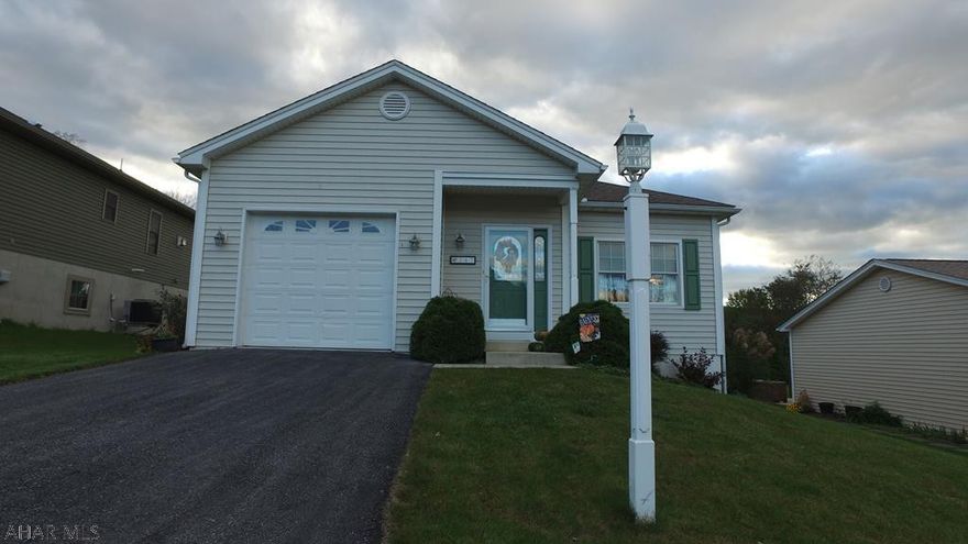 This home's wonderfully thought out design allows all the comforts of one floor living while enjoying the convenience of an in town location.  Watch deer and wild life stroll by the patio doors from your kitchen while you cook up a fabulous meal.  Hickory cabinets & ceramic tiled back splash add warmth to the space.  The master suite is bathed by an abundance of natural light while your guests have the convenience of their own bathroom.  The lower level offers plenty of natural light with an additional bedroom with walk in closet.  The lower level also offers the advantage of room for an exceptionally large recreation room.