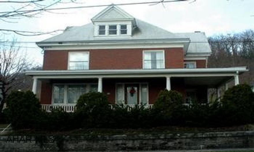 Sold AS IS: Classical and spacious 2-story brick home close to downtown Everett. Being sold "As-IS", this classical 2-story brick home with wrap around front porch and full basement features high ceilings and hardwood floors. The 1st floor features spacious entry foyer, large living room, stately dining room, eat-in kitchen with laundry nook, a 1/2 bath and a cozy enclosed summer porch. The 2nd floor offers 3 spacious bedrooms, a unique loft area, full bath with claw-foot tub and a very inviting sun room that looks out over the backyard. The walk-up attic is decked and windowed on 4 sides and offers potential for finishing to expand the living area to 3 stories. Off-street parking and a one car garage is located at the rear of the property. With work this home counl be as prestigious as it once was.