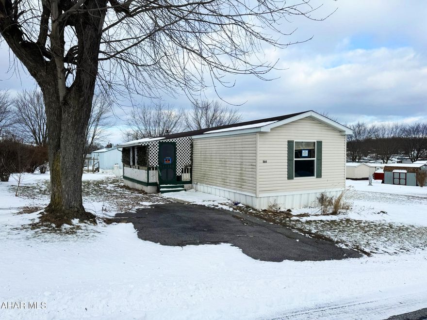Nestled just inside of rural Martinsburg, PA, 564 Camerer Lane is calling you home.  With three bedrooms and two full bathrooms, there is plenty of room for everyone. The covered porch welcomes warm evening relaxation and the open-concept kitchen and living room provide a bright and inviting space for enjoying family and guests. This home is located in the Spring Manor community and is close to Henry's Pond, restaurants, cafes, local businesses, and Morrison Cove Memorial Park which includes a playground, skating rink, bowling alley, outdoor pool, library, and fairgrounds. It is also in proximity to Altoona-Blair County Airport. The lot is owned by Regal Communities, and lot rental fee will apply. Buyers must submit an application to Regal Communities to make an offer on the home. Application fee is $50.