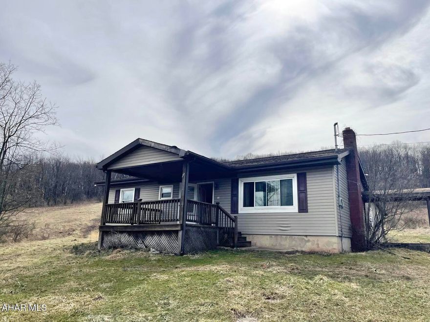 Ranch home with covered front porch, eat in kitchen, large step down living room, 4 bedrooms with one being a master suite. Covered back patio area. No well or septic.