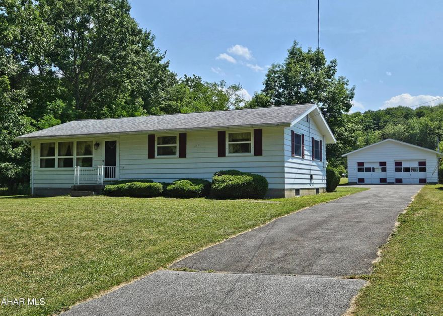 Antis Township ranch with 2 car garage. 3 bedroom, 1 bath on an acre.  Additional sewer tap available to subdivide if desired.
