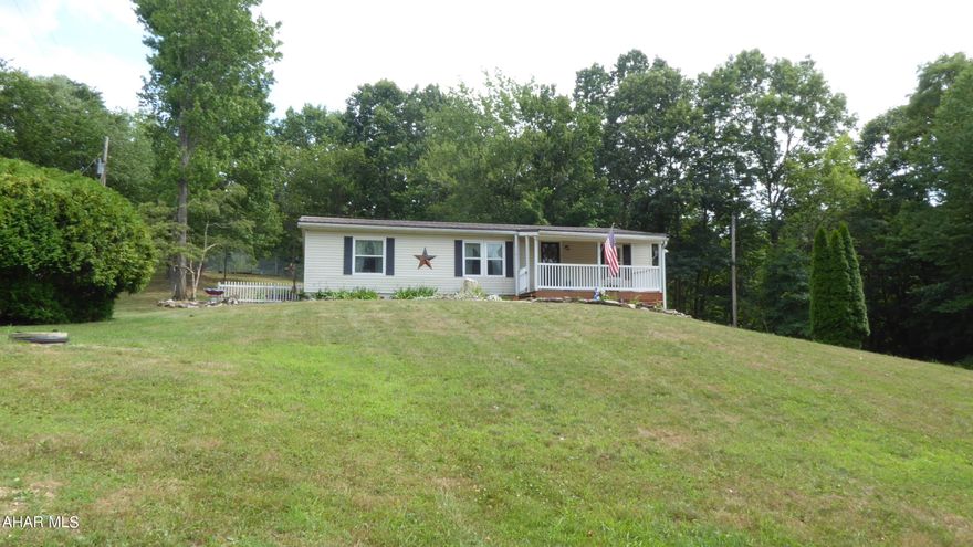 Location, location, location!  Short distance from Shy beaver boat launch and Raystown lake.  Situated on top of the mountain giving you privacy and serenity.  The property offers blueberry bushes, black raspberries, fruit trees, and so much more.  The back porch is perfect for watching the wildlife and birds.  Basement has bonus room for guests, game room, or craft space.  Complete with an integral garage.  Great for year round living or for a second home.