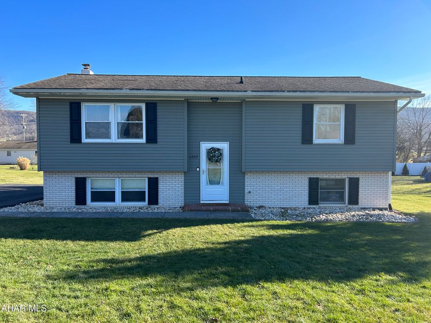 Location, location, location. This home is a 15 minute commute to Penn State University! Country living yet so close to everything including the University. Neighboring Mountains & farm fields set the background for this splendid split-entry nestled on .34 acres in the Bellefonte School District. All freshly painted and many cosmetic updates throughout. So cozy & inviting...there is nothing to be done but move in and enjoy this pristine home.  The open concept floor plan delivers luxury vinyl plank flooring throughout most of the house, heat pump & central air conditioning. The main floor also features 2 nicely appointed bedrooms & a remodeled full bathroom with tile flooring. The finished walk-out basement boasts a spacious bedroom with a walk in closet that could easily be used as a family room, a remodeled full bathroom &  laundry room with included washer & dryer. Plenty of off street parking for vehicles. Whether you are commuting to State College, downtown Bellefonte or Lock Haven this location can't be beat. Call today for your personal tour as this one will not last.