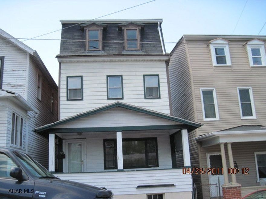 Good investment or 1st time home buyer.  1st floor Laundry Room & 3/4 Bath.  Back porch roof needs repaired, 3 to 5 BR home, 2 BR on 3rd floor with heat, needs work.