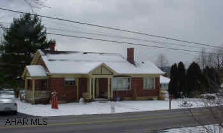 One and a half story brick on Lower Brush Mountain Road. Finished basement, Gas H/W heat, fireplace and woodburner. Full finished basement. Excellent condition.  Electric is fuse and breaker combination. Very well maintained One and a half story brick. Finished basement, fireplace in LR. All appliances stay. Excellent condition.