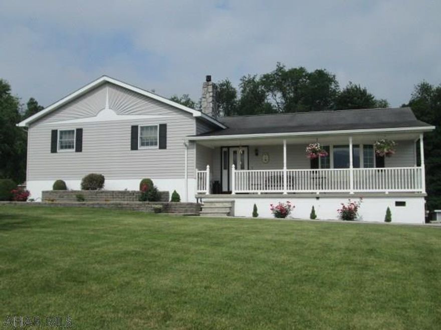 Custom built multi level featuring many extras. The updated eat-in kitchen features upgraded cabinets and beautiful custom tile floors. Enjoy entertaining in the large dining room that opens to heated sun room. The Master Bedroom Suite has walk in closet and large Master Bath.  The lower level has family room with gas fireplace, kitchenette, office, laundry room and half bath with urinal.  As a bonus, there is a hot tub room with wood stove for year round use. Don't miss the walk in refrigerator in the garage and the above ground pool!