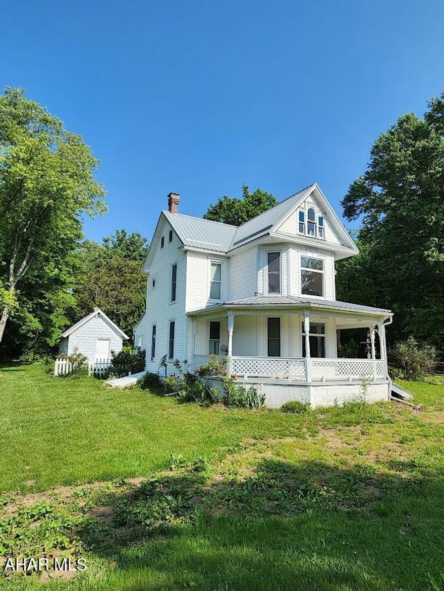 Here is Rural living at its best. This 3 bedroom, 1.5 bath, Victorian farmhouse sits on 2.5 acres and boasts a bonus renovated building that could be made into an additional living space. An established, raised bed garden, chicken coop, and small barn can help you use the land to it's full potential. Many perennial plants, fruit bearing trees and berry bushes line the property. Come see this home complete with a white picket fence and roses.