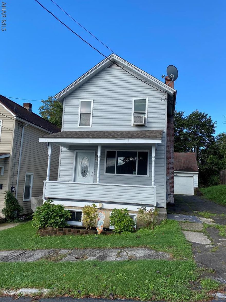 Adorable two-story home for sale in Hollidaysburg Borough! This home features 2 bedrooms with new flooring and a bonus room with a build-in desk arear for a home office or 3rd bedroom. The living room has hardwood floors and freshly painted walls. The dining room is open to the kitchen, which has white cabinets with a herringbone backsplash.