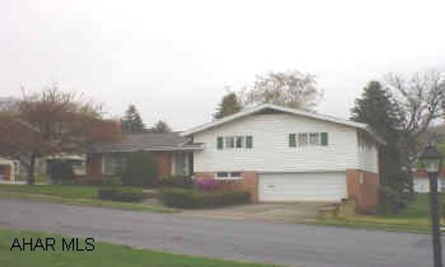 Brick & vinyl , split-level on corner lot. 4 bedrooms, 2 1/2 baths, cathedral ceilings, central air, many amenities.