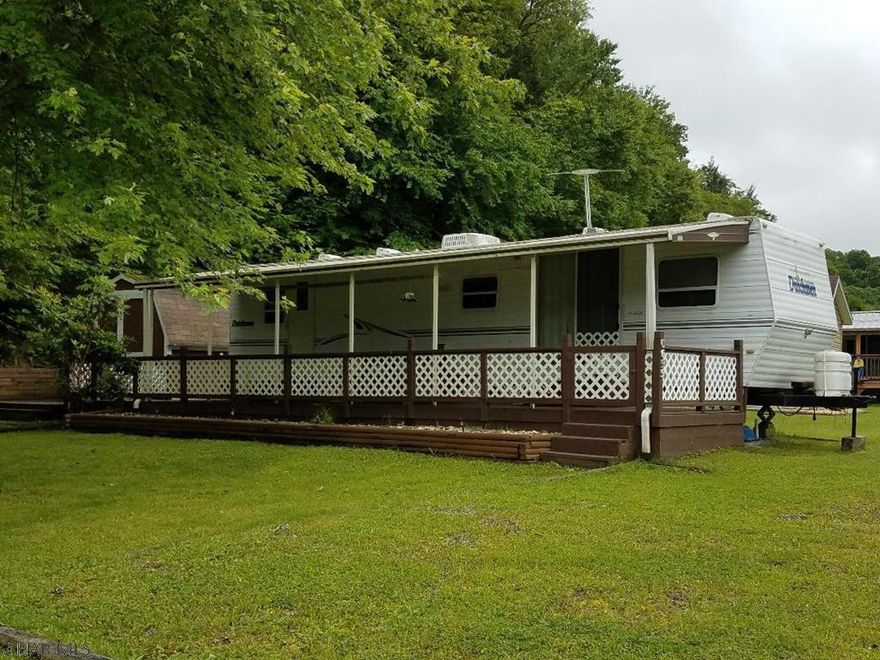 38foot Dutchman camper w/covered deck, shed,2nd lot w/pavilion & shed. Well maintained unit with 2 bedrooms 1 bath on a nice lot. Minutes from the state park, state game lands, & Rock Run.