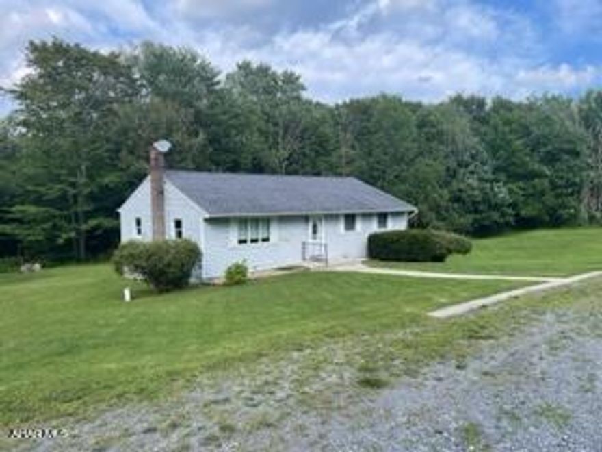 Ranch house at the end of a private lane with other homes. Gravel road is maintained by the homes on this road. 5.17 acres of lawn and woods.