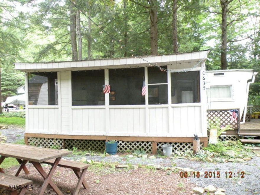Affordable get away. Older camper w/ addition, screened porch & deck. Cute 2 BR unitwith nice shed & cute yard.