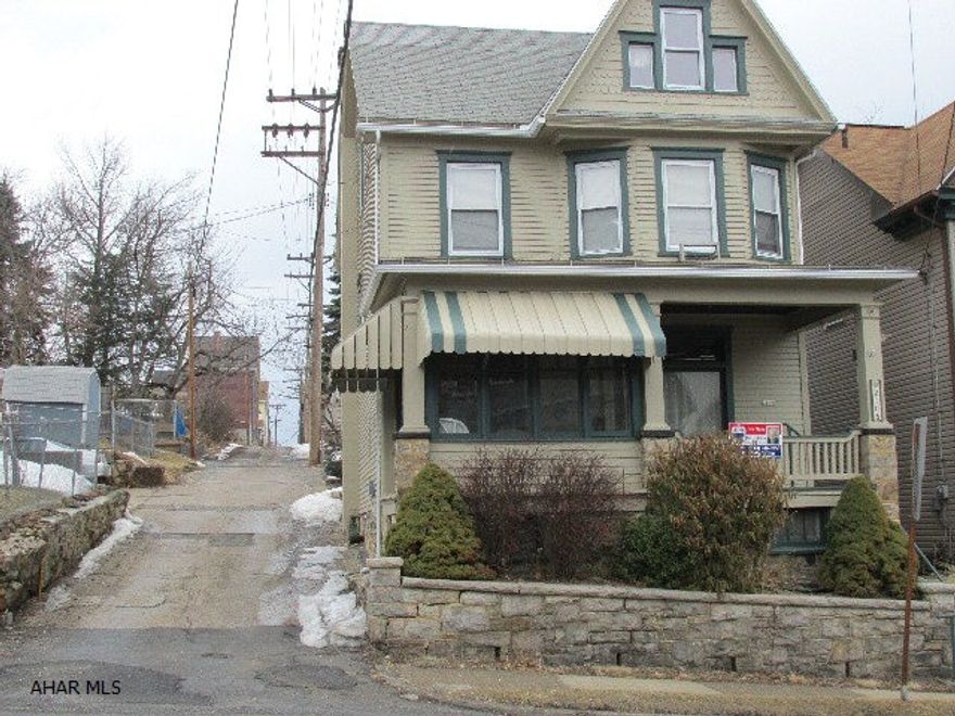 So much character in this 3-4 bedroom home!  Natural woodwork, stained glass windows, hardwood floors throughout, enclosed front and back porches, off-street parking.  Freshly painted exterior.