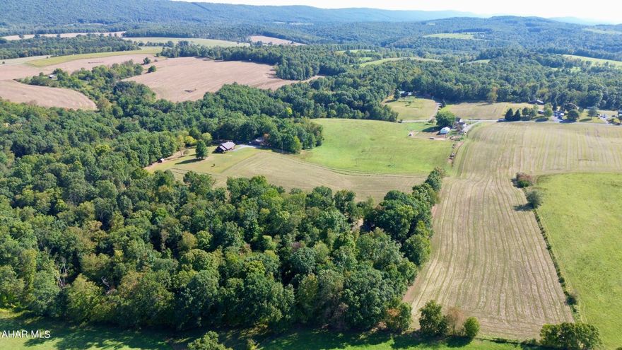 15.7+/- acres with a well, septic, and a 12'x40' shed offering a nice building site with great views of the surrounding countryside. The property consists of open and wooded land and would make a great location to build a home or getaway.