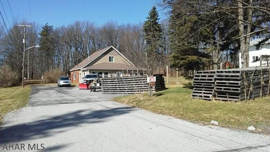 2 story 3 BR home with a large detached garage. New roof, new 2nd floor. Large open kitchen. Fireplace could be wood or gas. The 2+ bay garage has high ceilings & rear shop area. 1900 sq ft.  New overhead doors, newer roof, 1/2 bath and 6" cement floor