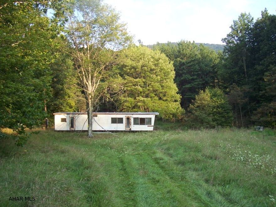 Recreational property and Great Hunting! A small pond and stream on 2.86 acres. Property has 2 holding tanks. ATV access to State Game Land with neighboring land owner permission.