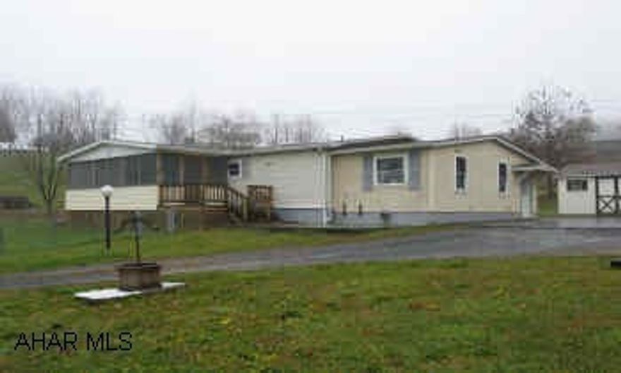 3BR/2BA Shuttered Double wide in nice location. Enclosed deck, vinyl siding, 2 outbuildings.  Finished room in basement. Immediately available. Home Warranty Included