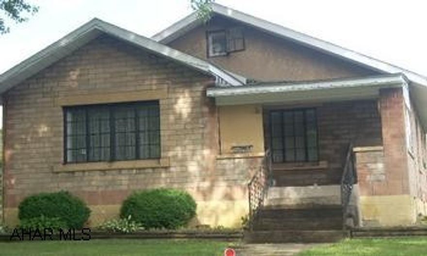 2 bedroom block Ranch home. Corner lot, new furnace and newer roof. 2 bedroom home with newer heat system and roof, hardwood floors. Nice 110x119 corner lot. Needs some TLC.