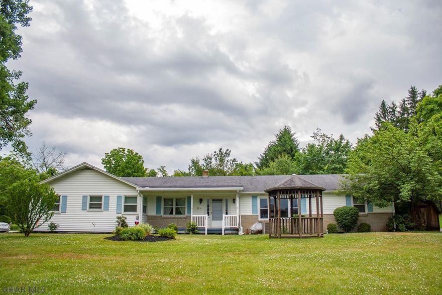 Single-level 3 bedroom, 2.5 bath home with attached garage and finished basement. Large, flat 0.85 acre lot in the Loop.