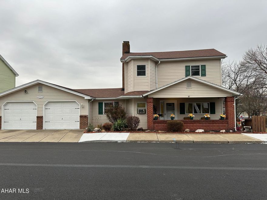 SO MUCH SPACE......in this two story with a two car attached garage and family room addition. First floor living room with brick gas fireplace, family room, eat-in  kitchen, laundry and mud room. The second floor offers three spacious bedrooms and a large bath. There is plumbing on the first floor for a half bath...just needs to be completed.  This is all situated on an 85x120 fenced lot with an ADDITIONAL 2 car garage in the back. Large back deck for entertaining and also a cozy front porch for evenings.  This home has so much to offer....it won't last!