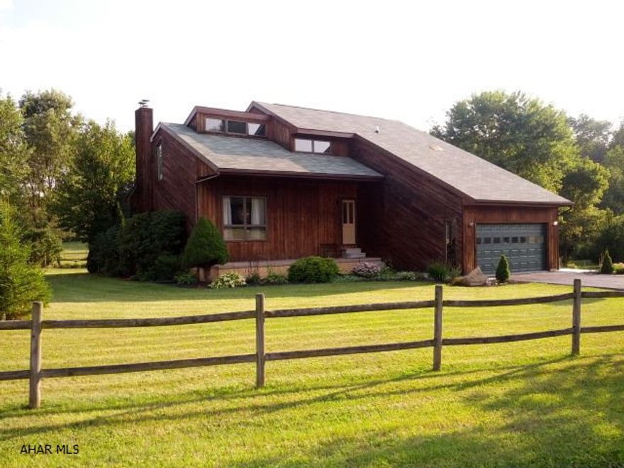 Bellwood-Antis Schools.  3 bedroom, 2.5 bath contemporary home has eat-in kitchen with island counter and built-in desk and cabinets.  Vaulted ceilings in family room and bedrooms, 3 skylights, spacious master bedroom and master bath, nice backyard with 3-tier deck.  #J-211