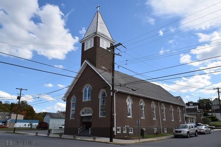 This former church with attached parsonage is in great condition. The  lower level of the church has been converted into an large open concept 2 bedroom 1 1/2 bath apartment. The parsonage (1101 Cambria St) is a spacious three bedroom home with an additional bonus living space above the garage and currently has a long term tenant. Full security system with cameras.The apartment has updated wiring throughout and both the apartment and parsonage are equipe[ted with new high efficiency hot water boilers. This great property offers many possibilities. Contact listing agent for more information.