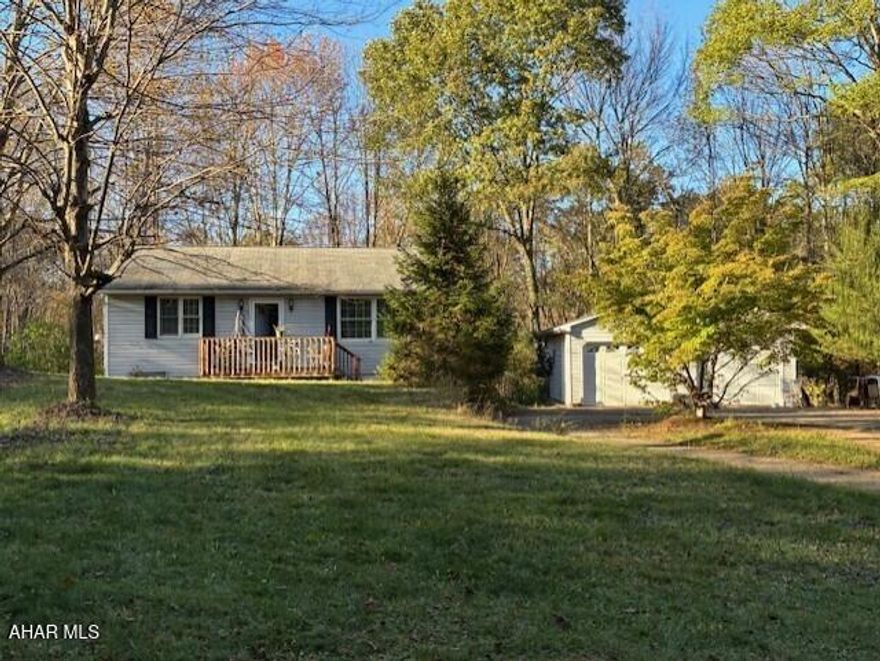 This home is nestled in a private community and consists of eat in kitchen, living room with fireplace,  a full bath and 2 bedrooms. upstairs.    located downstairs, is a bonus room with a fireplace  with laundry room hook ups and a small kitchen prep area and a 3/4 bath  there the walkout basement.  Two car detached garage. With a little love and  some elbow grease this property  would be brought back to make the right person a wonderful place to call home It is located a short distance from Seven Springs Ski Resort