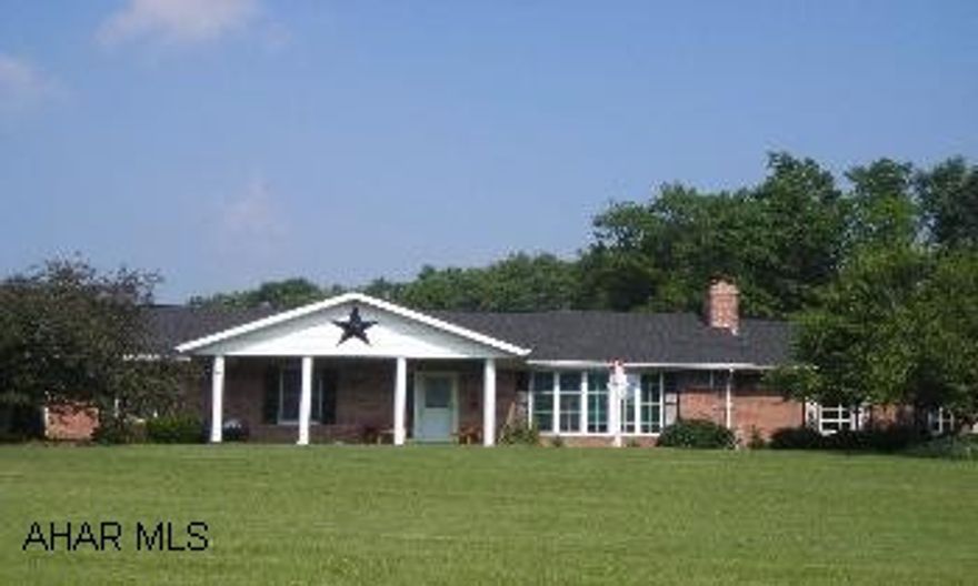 Excellent pride of ownership in this one owner brick ranch! One floor living;great floorplan for entertaining;quality throughout! Attached garage is tiled and could be easily converted to extra living space. Lower level is finished with a 16 x 16 bedroom and a 16 x 38 family room area. Large MBR on main floor could be converted to 2 bedrooms. Roof in 2005 - 35 yr shingles;Andersen windows throughout;2 x 6 construction w/12" fiberglass insulation in attic, 6" fiberglass in walls. Three outbldgs - chicken coop 8 x 14, barn 40 x 40, metal barn 24 x 48 with insulated cement floor and all utilities. Also an add'l shed. Hunting cabin 8 x 14 at back of property has wood stove, porch. Wisteria-covered, completely screened gazebo, deck, perennial gardens with fountain, many fruit trees. Well is 135' deep. Complete quiet here, lovingly maintained.