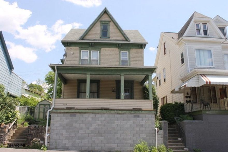 Great starter home walking distance to schools. The 1st floor large rooms with all natural woodwork throughout. There are pocket doors leading into the dining room with vent-less gas fireplace, and bonus room which is currently used as the laundry area. Beautiful staircase leads to 3 large bedrooms, sitting area and a walk-up attic that could be finished for additional bedroom or plenty of storage. Off street parking and fenced yard.