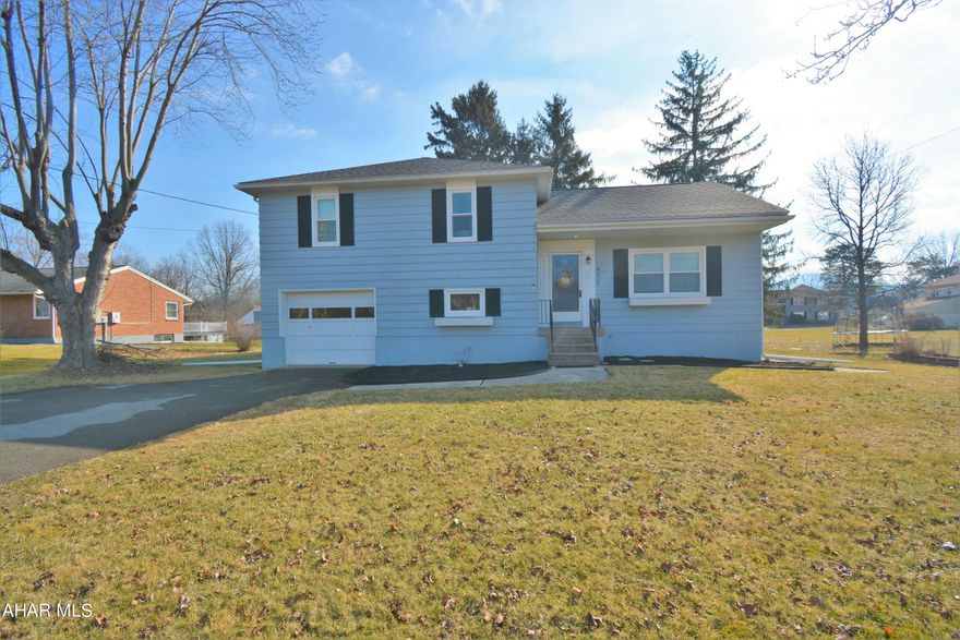 --OPEN HOUSE SUN 2/19 12:30-2PM🎈-- Marvelous Multi-Level in Hollidaysburg School District!  This 3 Bedroom, 2 Bath home is cute as a button & Ready for Y-O-U!  Upon entry from the front you will find yourself in the formal living room with hardwood floors & nice natural light.  This flows right into the UPDATED kitchen with nice counters, ceramic tile floors & SS appliances.  It's an easy trip down a few stairs to the lower level which has a Family Room & 3/4 bath, each with vinyl plank floors.  You can also access the single car garage & backyard from this level.  Below this is the basement with utilities & plenty of room for storage.  Upstairs are the 3 bedrooms, each with hardwood floors and the super sweet full bath with tile surround & built in shelving. There are two closets up here with one giving access to the attic which is great for storage too.  This all sits on  .24 acre in Hollidaysburg Borough with a nice backyard that is sure to please this summer!   Home has a newer heat pump so AC for the upcoming summer months is covered too.  Call today to set up your showing!