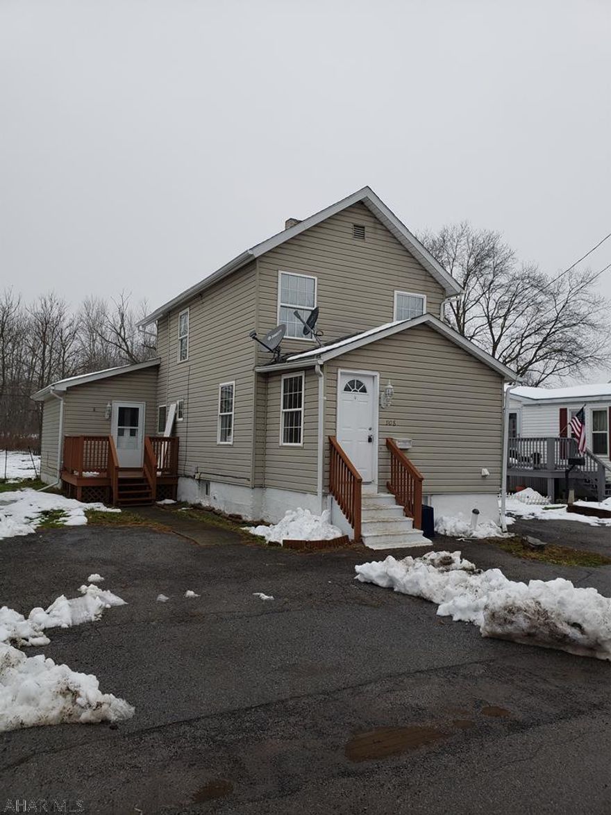 Super value in the heart of Bellwood!  Property features included vinyl siding, wrap-around deck, newer windows, flat fenced yard and off street parking.  The interior features muted tones, laminate, and ceramic tile flooring, and recessed lighting.  The property features a newer furnace (6 years), central air (4 years) and hot water heater (2 years).  The unique layout of this home will make entertaining a breeze.  Additional features include a first-floor bedroom, full bath, and laundry room with included washer and dryer.  Priced to sell, please call the listing agent today to schedule your private showing of this property!