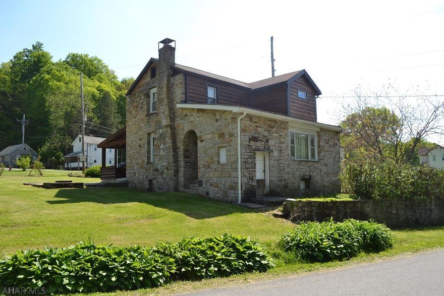 This lovely stone 2 story within 20 minutes of Lake Raystown would make a perfect full time residence or a weekend retreat.  A perfect place to relax with a stone patio and large covered back porch.  2 bedroom 1 bath, gas fireplace, walnut trim, laminate floors, eat-in kitchen.  Lots of parking area, even for a full size RV.  Call today to setup your showing.