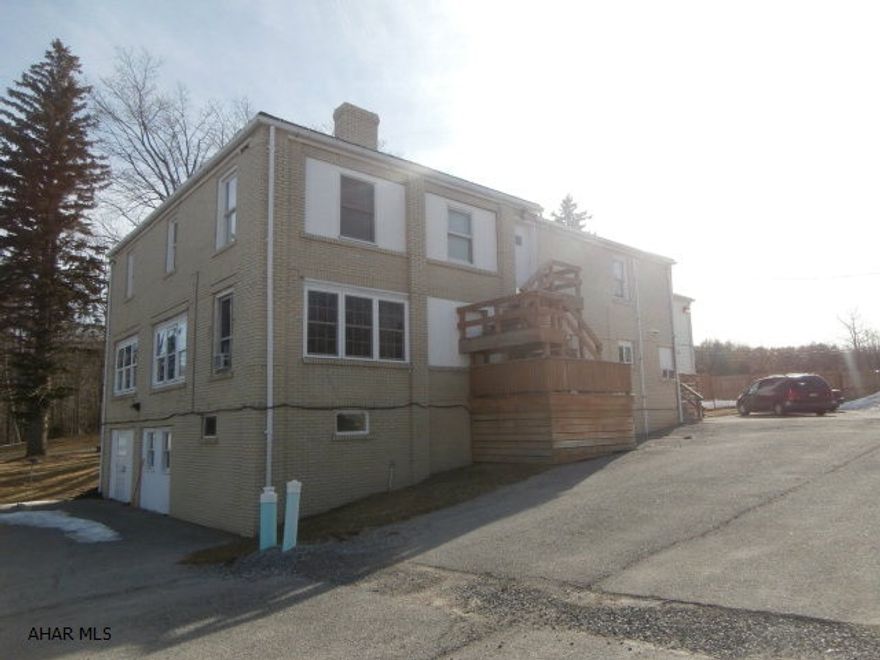 Used as a group home this well built building could be converted to single family, apartments or boarding type use.  Large lot with exercise area, building in good condition - great value!!