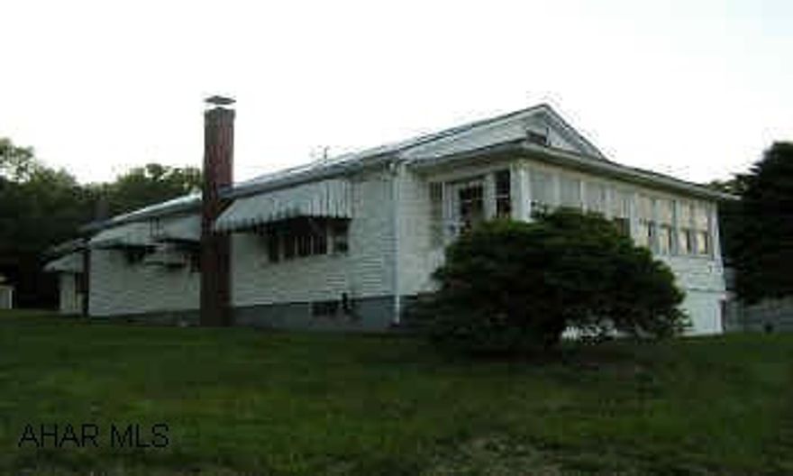 One Story 2BR/1BA frame/vinyl on 1+ acre with good view. Full unfinished basement, hardwood floors throughout. Enclosed front porch. Outbuildings on large shaded lot, laundry / mud room. Offered AS-IS AND WHERE IS.