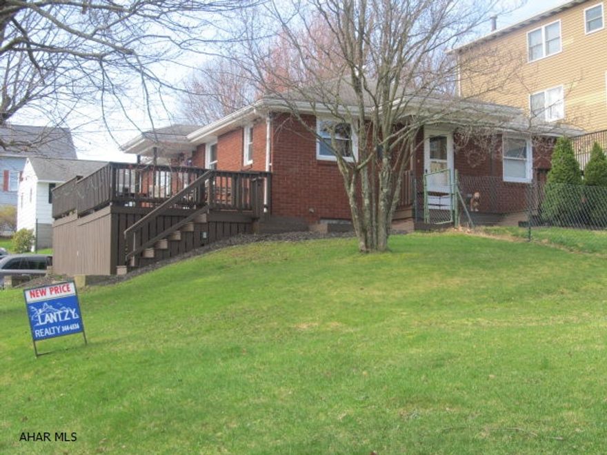 1 story brick home on corner lot with integral garage, hardwood floors, and partially finished basement.  Move-in ready.