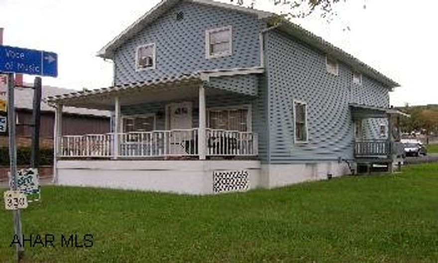 2 story vinyl sided with 2 rental incomes.  2 seperate furnaces with central air on first floor only, off street parking for 6 plus cars.  Great location and value. Opportunity knocking!  Little effort can convert this property back to single family or live above and have the ability to have two rental incomes. Also has high exposure to traffic, great location for a small business, office, beauty shop, etc., while still having two rental incomes. Seperate utilities. Off street parking for 9 cars.