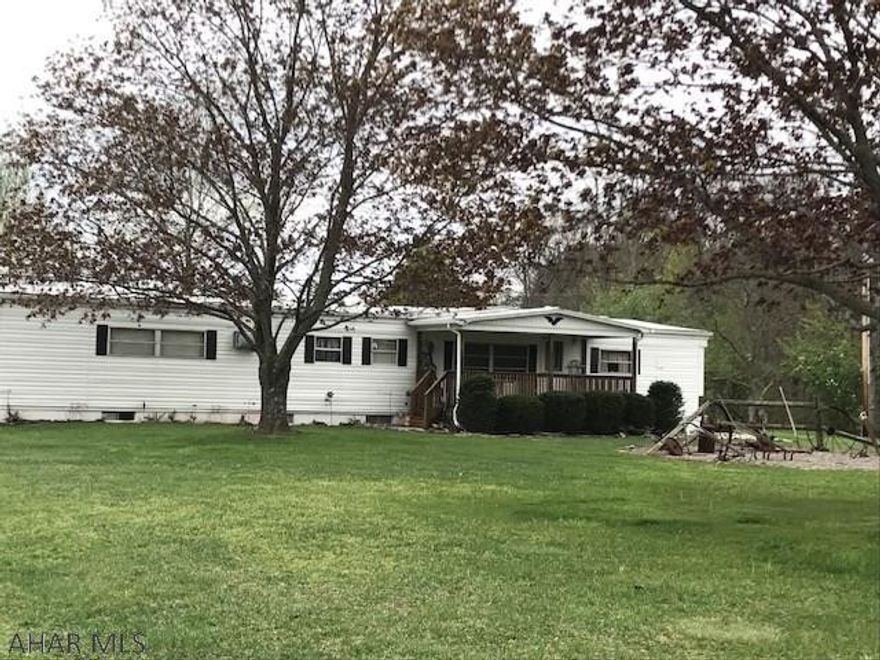 Adorable 3 bedroom, 1  bath home with additions on a full foundation.  Beautiful location with a one car garage, outbuildings and a large yard.