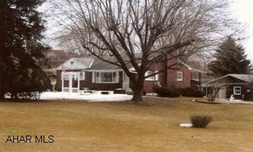 Charming 3BR brick rancher on large landscaped lot w/mountain view. Home inclueds finished basement w/kitchen, large covered patio and all appliances. Property also includes an extra large 2-car garage, single car garage and storage shed.